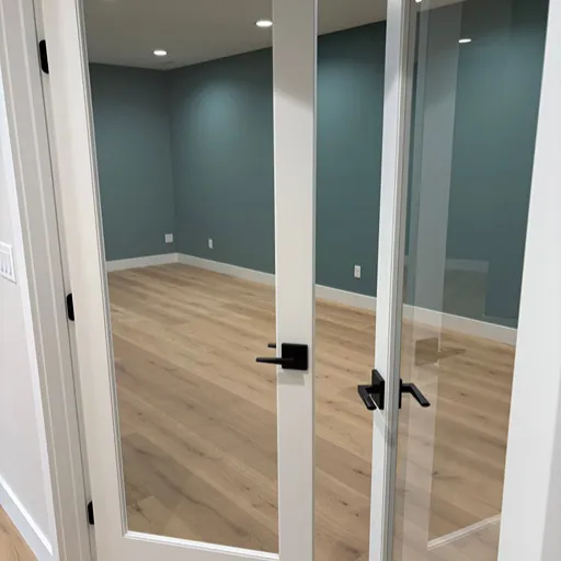 Commercial flooring installation in dark teal office 