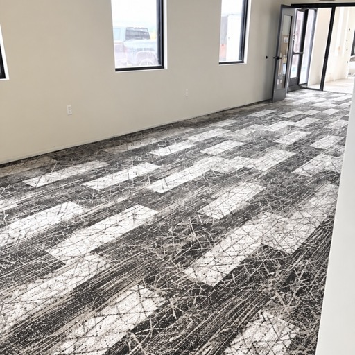Commercial carpet tile installation in office hallway
