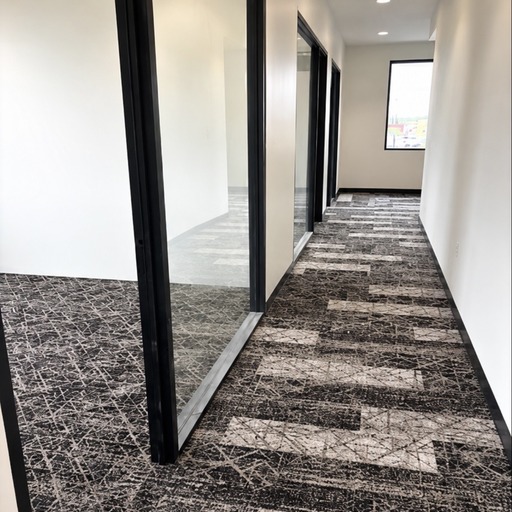 Commercial carpet tile installation in office hallway