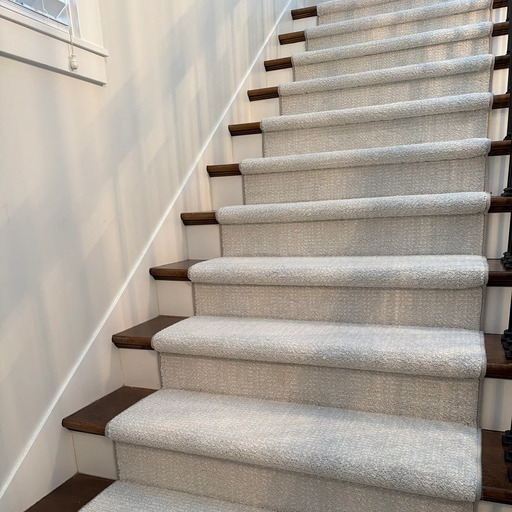 Residential carpet stair runner installation